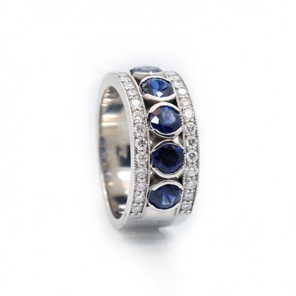 This is a picture of a Blue Sapphire and Diamond Ring