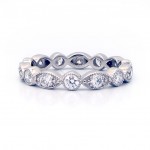This is a picture of an Alternating Round and Marquise Bezel Diamond Swing Ring