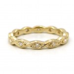 This is a picture of a 14k Yellow Gold Marquise Bezel Eternity Band