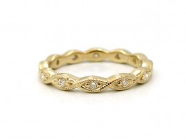 This is a picture of a 14k Yellow Gold Marquise Bezel Eternity Band