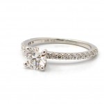 This is a picture of a 14K White Gold Four Prong Ring with Diamond Band