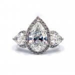This is a picture of a Platinum Three Stone Pear with Halos Engagement Ring