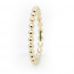This is a picture of a 14k Yellow Gold Bead Band