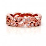 This is a 14k Rose Gold Diamond Floral Band