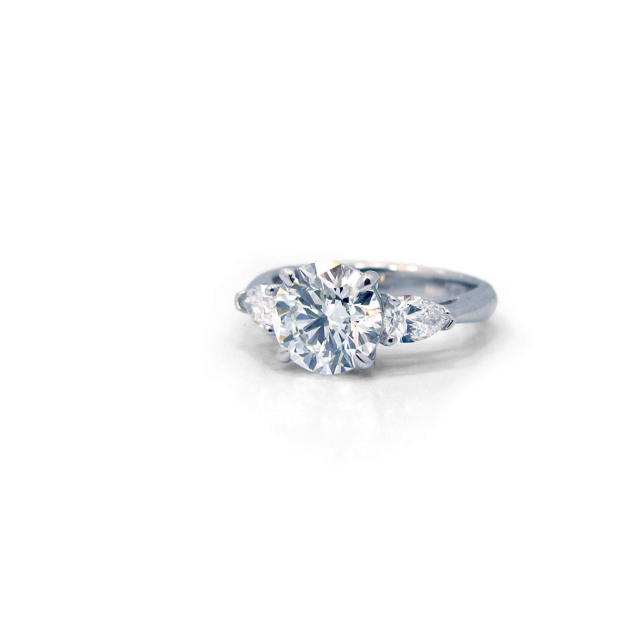 This is a picture of a Platinum Three Stone Setting with Two Pear Side Stones