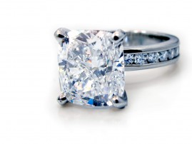 This is a picture of a Four Prong Platinum Channel Set Diamond Engagement Ring