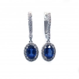 This is a picture of Oval Cut Blue Sapphire Earrings with Diamond Halo