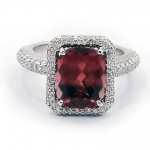 This is a picture of a Maroon Orange Tourmaline and Diamond Ring in Platinum