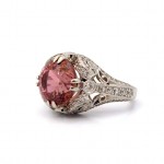 This is a picture of a Pink Tourmaline and Diamond Art Deco Inspired Cocktail Ring