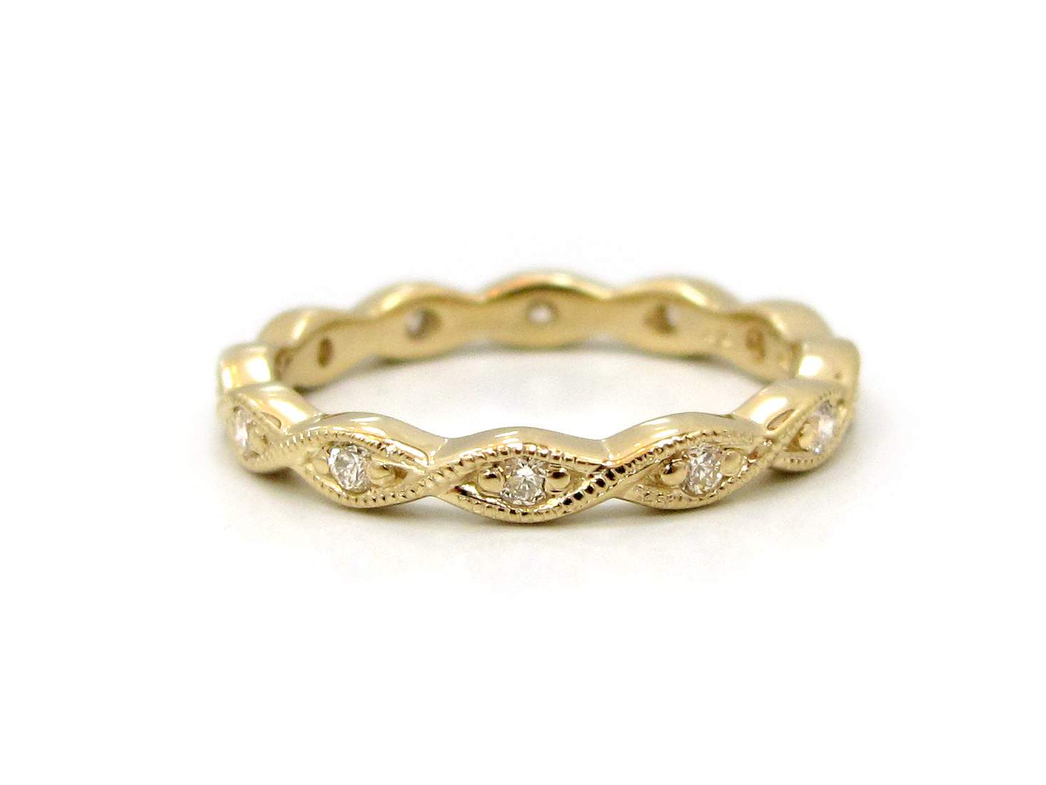 This is a picture of a 14k Yellow Gold Marquise Outline Eternity Band