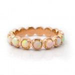 This is a picture of a 14k Rose Gold Opal Eternity Band