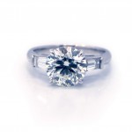 This is a picture of a 3 Stone Round with Tapered Baguette Platinum Engagement Ring