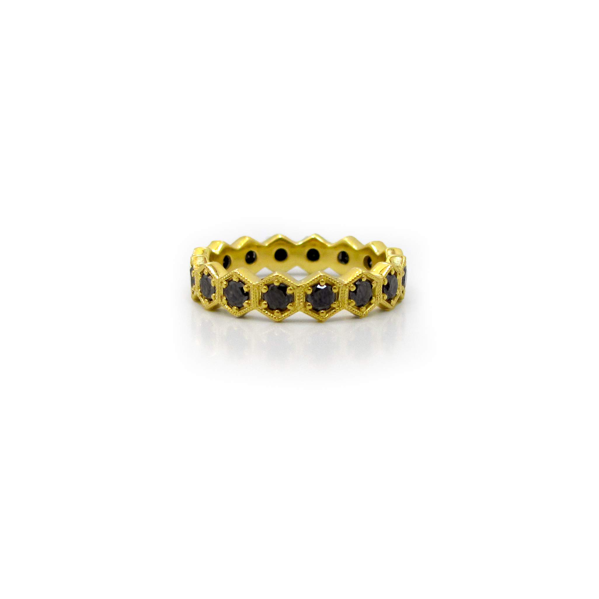 This is a picture of a Black Diamond Eternity Band in Hexagonal Bezels
