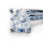 This is a picture of a Four Prong Platinum Channel Set Diamond Engagement Ring