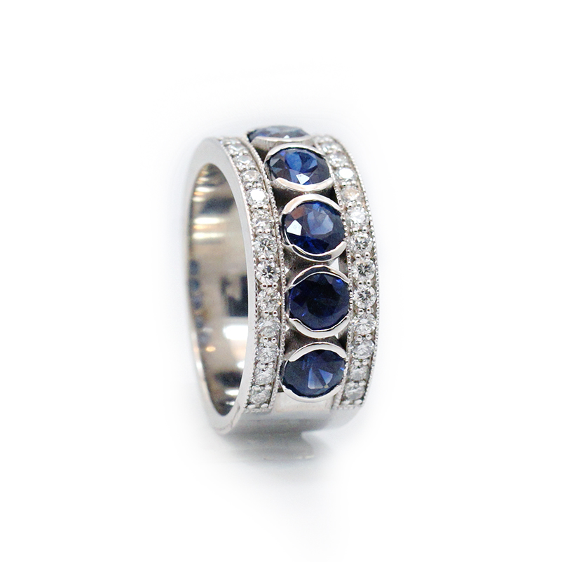 This is a picture of a Blue Sapphire and Diamond Ring