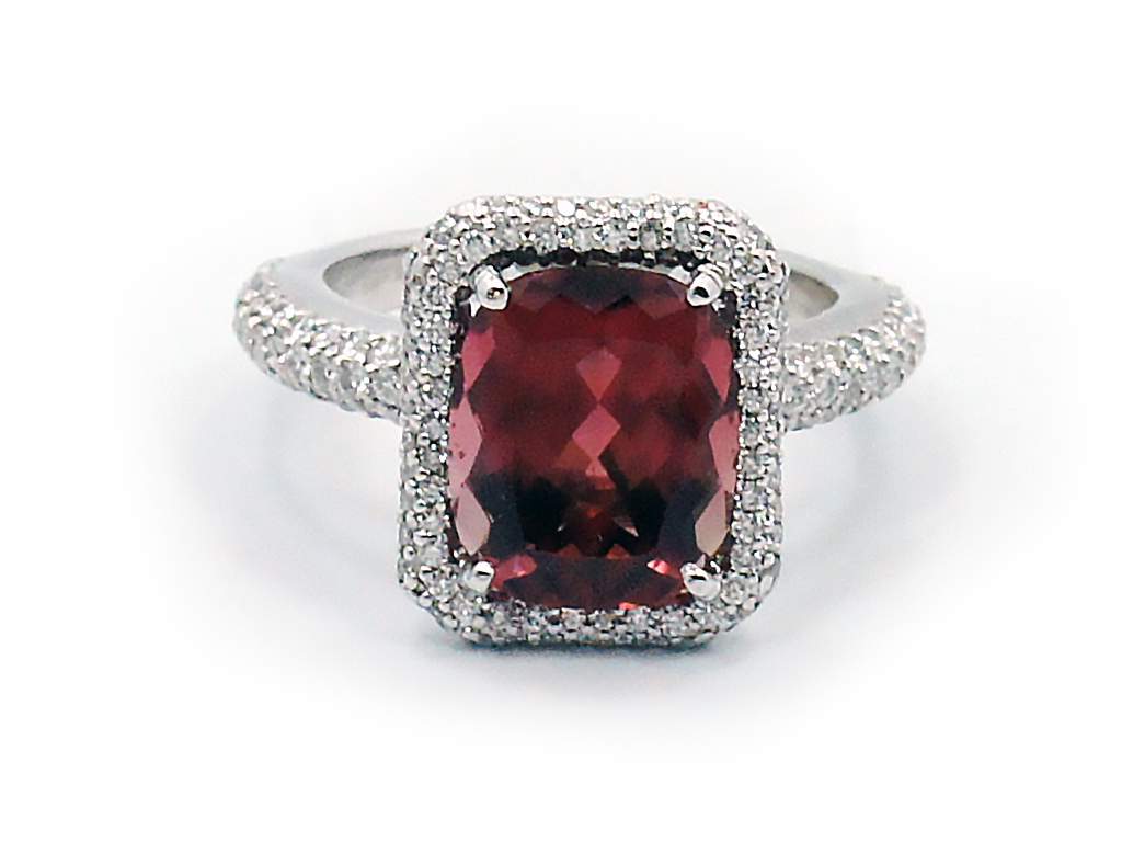 This is a picture of a Maroon Orange Tourmaline and Diamond Ring in Platinum