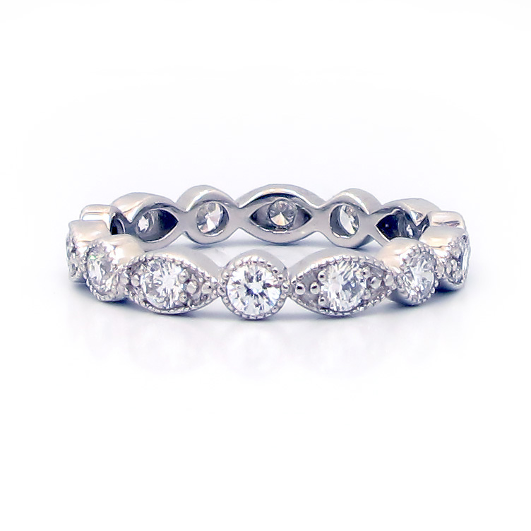 This is a picture of an Alternating Round and Marquise Bezel Diamond Swing Ring