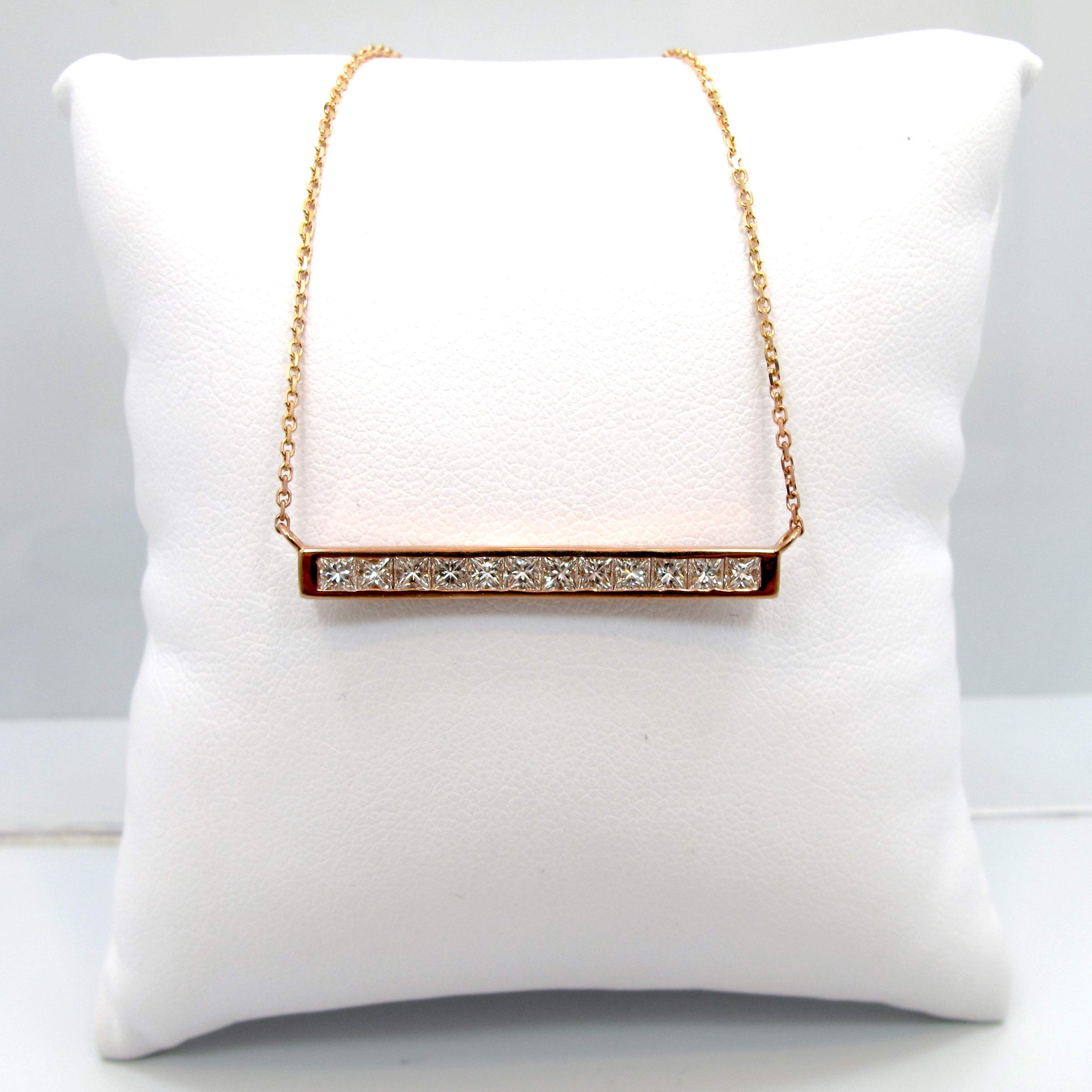 This is a picture of a Princess Cut Diamond Bar Necklace Set in 14k Rose Gold